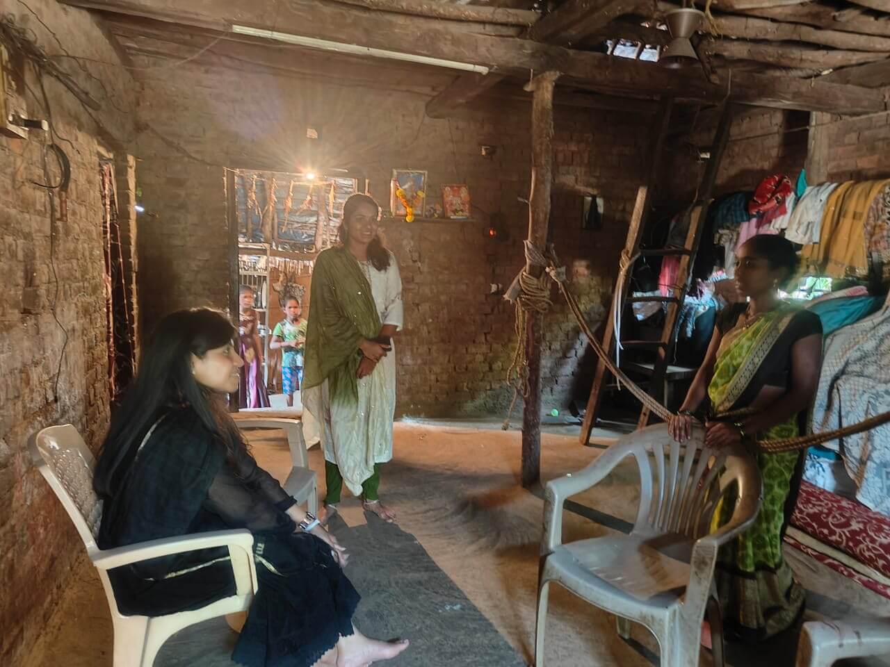 A Zuventus representative interacting with beneficiaries to understand their experiences.